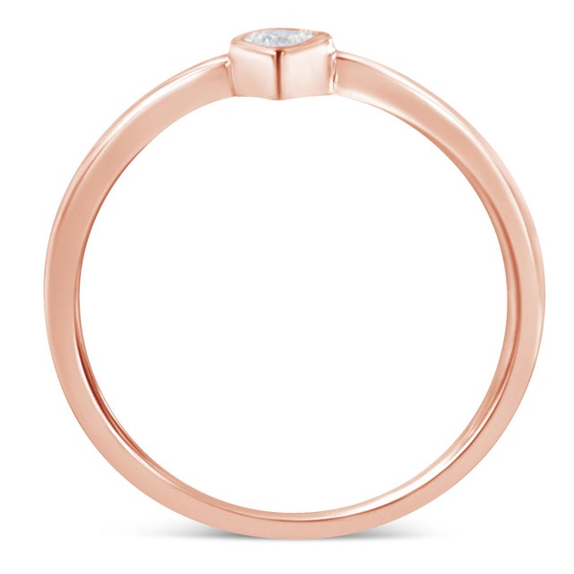 This delicate ring features a sparkling white diamond set in a band crafted in 2 micron 14 karat rose gold plated sterling...