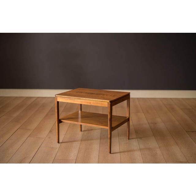 Mid century modern side table in walnut from the Declaration collection designed by Kipp Stewart & Stewart McDougall for...
