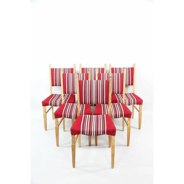 A very good set of 6 Danish mid-century modern dining chairs. The chairs are of solid wood frames and are well made. They...