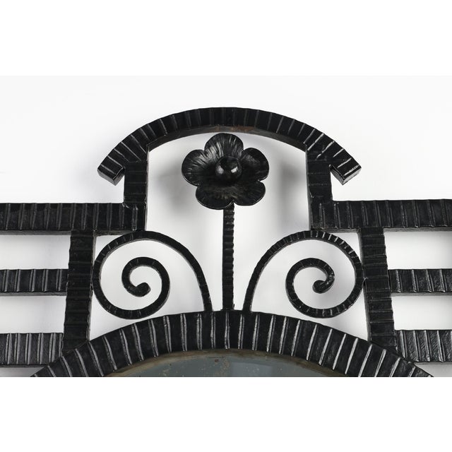 France / 1925 / Mirror / wrought iron / Art Deco A striking example of French Art Deco craftsmanship, this 1925s mirror...