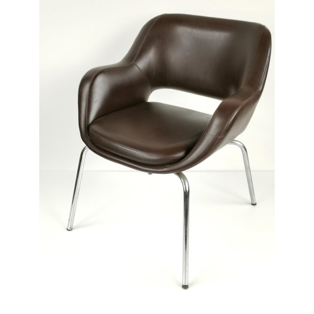Elevate your interior with this exceptional pair of mid-century modern armchairs designed by the iconic French designer...