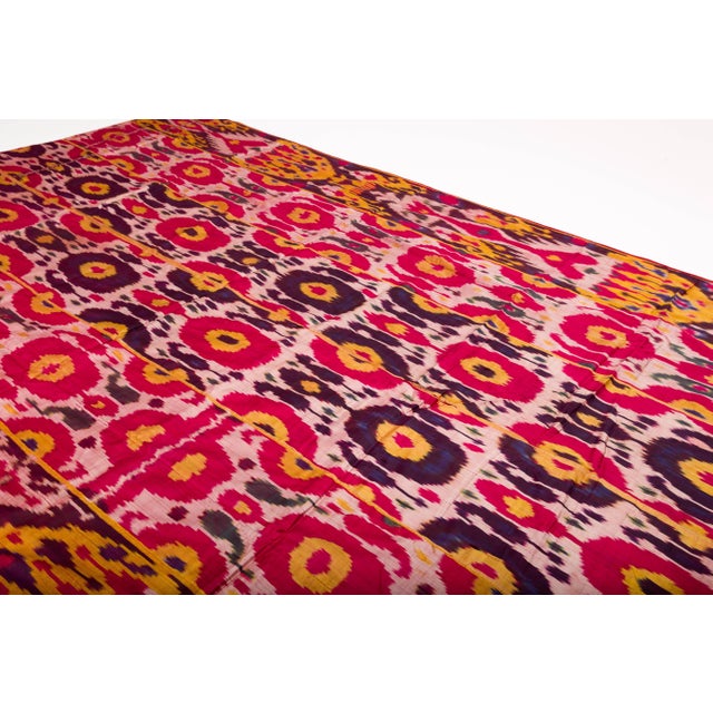Gorgeous handwoven silk Ikat weaving in rich magenta, gold and purple color, circa late 19th-early 20th century,...