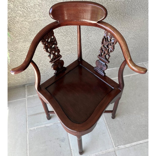 Excellent Pre-Owned Condition. Lovely-to-look-at Chinese import-style corner rosewood armchair, featuring a horseshoe...
