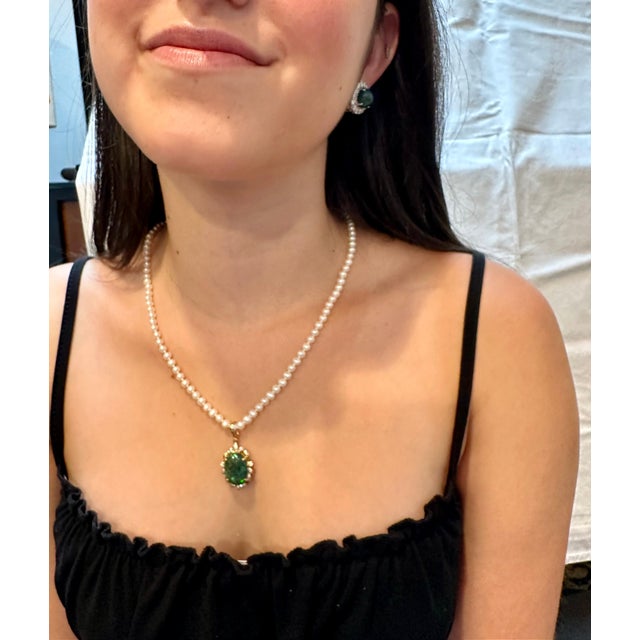 Introducing our exquisite 14K Yellow Gold Pearl Necklace featuring a captivating 4 Carat Oval Black Australian Opal...