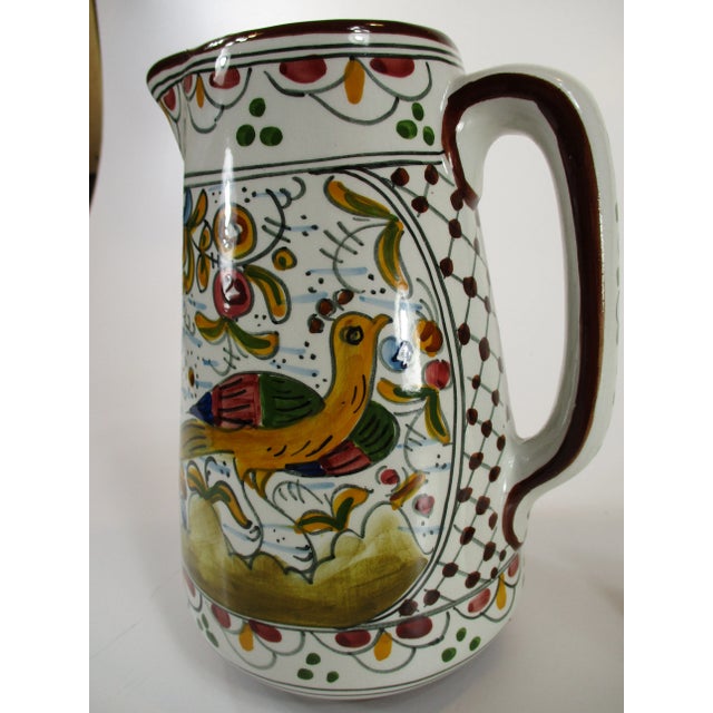 This vintage hand painted faience pitcher / jug from Portugal features a beautiful design. It is 8" tall. It is numbered...