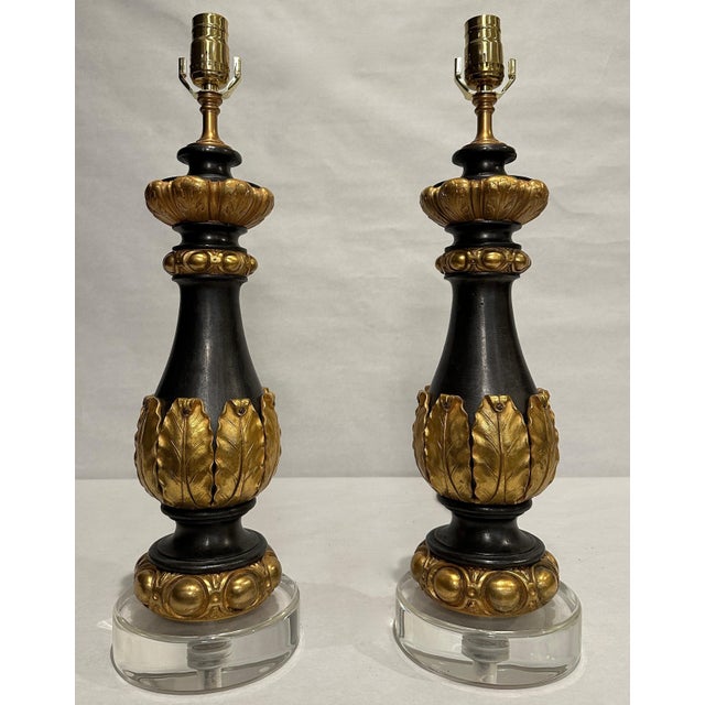 This sophisticated pair of table lamps has been created from authentic 19th-century Neoclassical garnitures converted as...