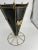 Eye catching mid-century modern umbrella stand. Sturdy brass frame shaped like an umbrella with a black metal tub with...