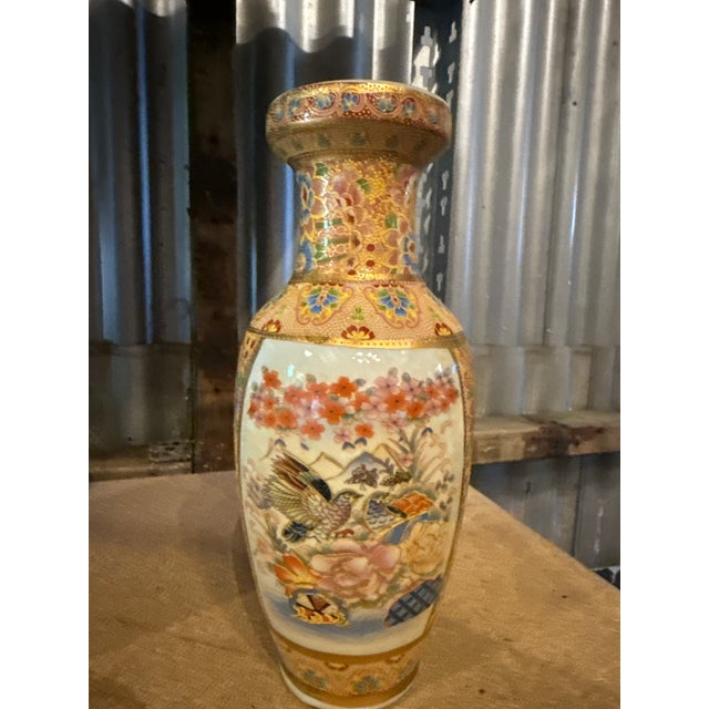 Japanese Satsuma Vase with Extensive Gilt Decoration and Floral Landscape Scene, Early 20th Century An elegant Japanese...