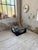 Vintage 1970s coffee table with a black patinated, molded base and graphic chrome details. We love its quintessential 70s...