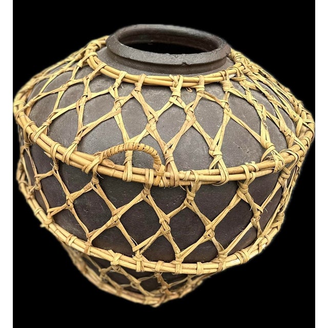 Vintage rustic pottery floor jars from the northern part of the island of Luzon. This sturdy terracotta jars were used to...