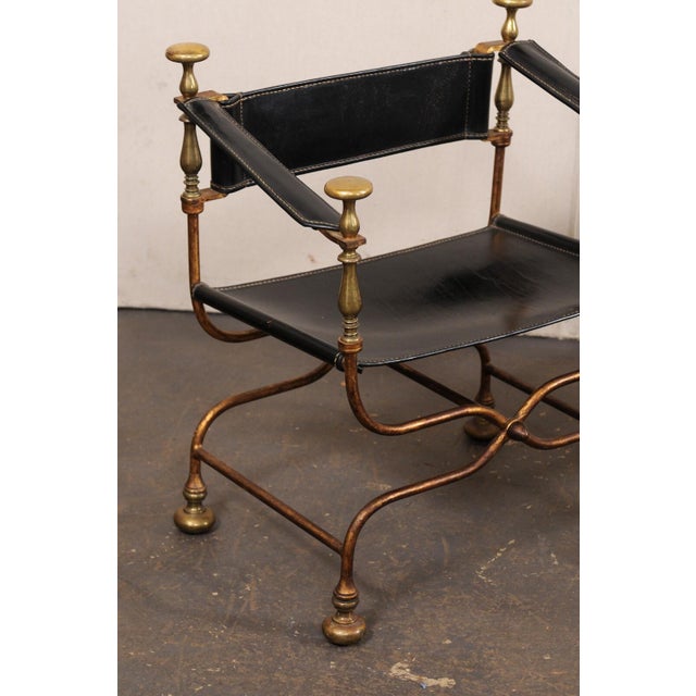 A pair of Italian curule savonarola chairs from the mid 20th century. These antique curule chairs from Italy, also...