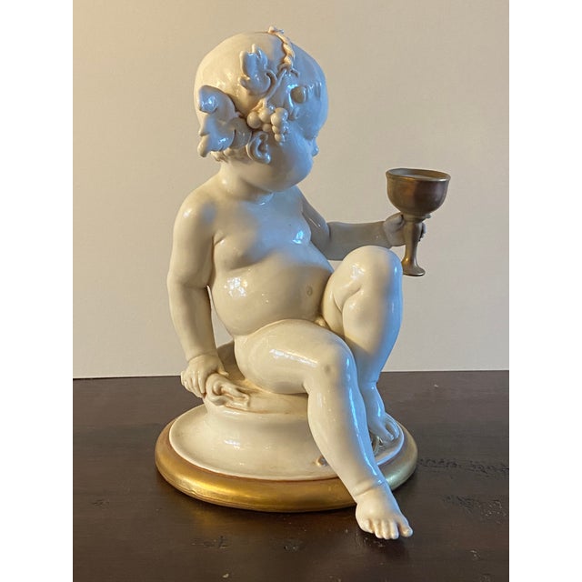 Absolutely gorgeous vintage porcelain sculpture by the famous Italian artist Giuseppe Cappe of a sitting baby cherub or...