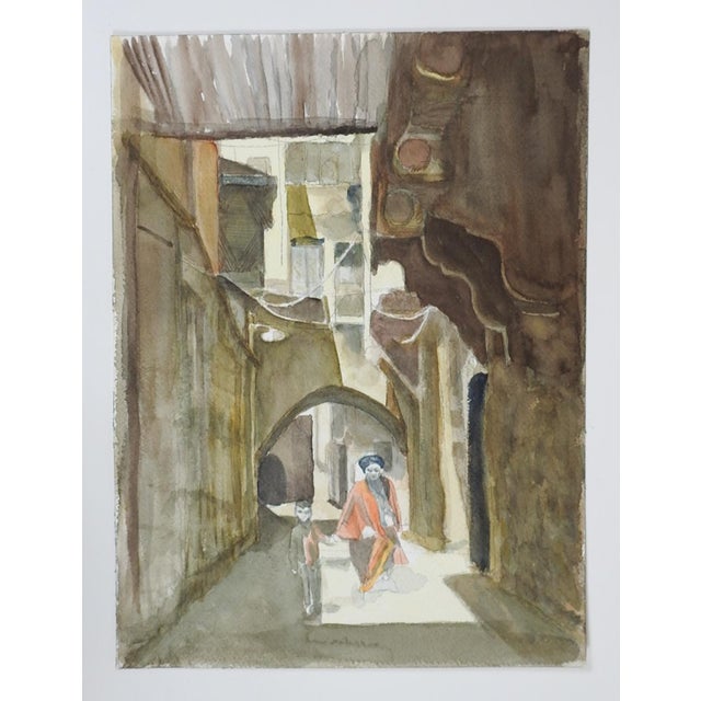 Late 20th century watercolor on paper painting of woman and child in a middle eastern cityscape. Unsigned. Unframed.