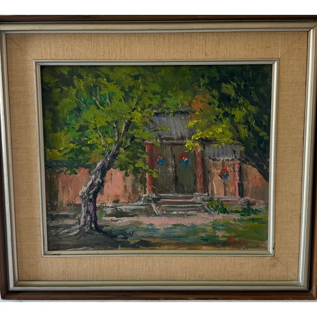 Original late 20th century oil painting on canvas. The piece depicts a courtyard or building entrance with leafy green...