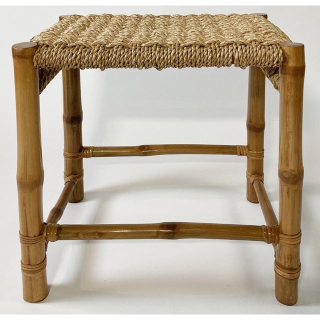 Vintage woven rope top stool with bamboo frame. Four legs supported by stretchers topped by uniquely woven top. Age wear....