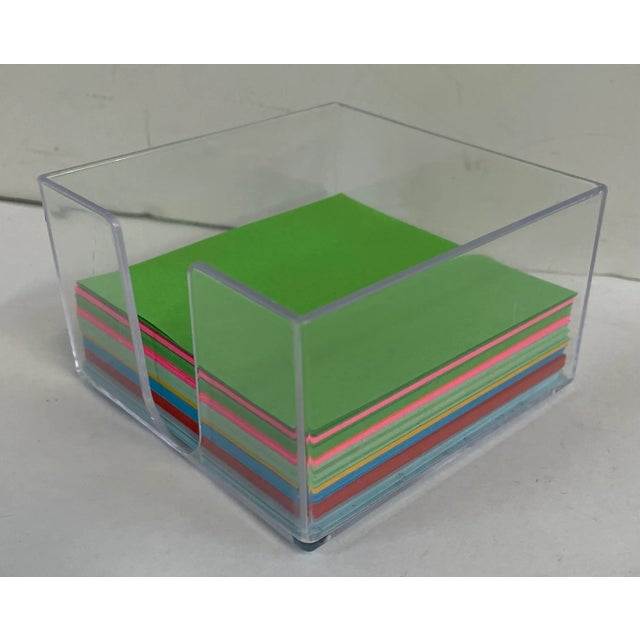 Cute little mid century lucite cube for holding note paper squares.