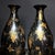 This is a striking and elegant pair of matching black lacquer vases. Crafted from a wood core and finished with a deep,...