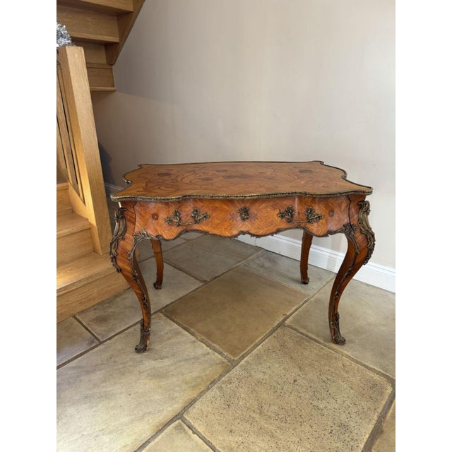 Outstanding quality antique 19th century freestanding French kingwood marquetry inlaid centre table, having an outstanding...