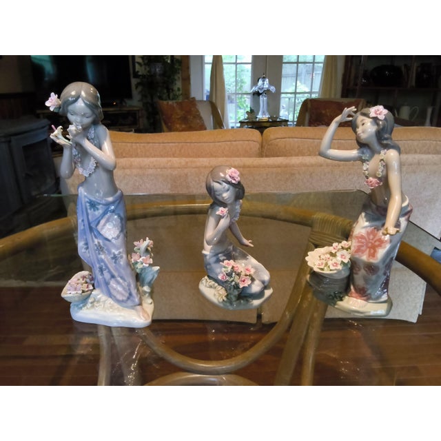 These three Lladró porcelain figurines are from the tropical Hawaiian series, all sculpted by the renowned Spanish artist...