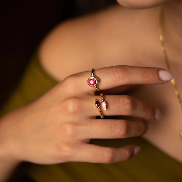 Celebrate passion and elegance with the Ruby & Diamond Teardrop Glow Gold Adjustable Ring. Featuring a rich red ruby...