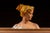 Painted plaster bust depicting an allegorical female figure in profile, based on Antonio Garella's "Poesia." The subject...