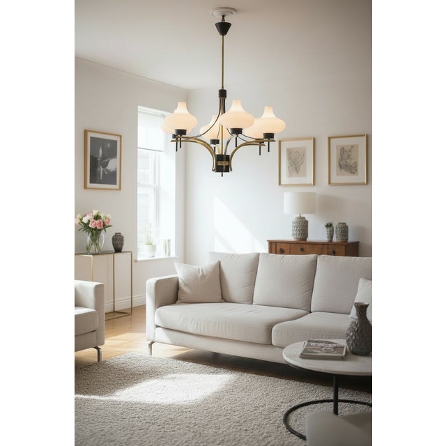 1950s brass & opaline glass six-light chandelier this elegant mid-century chandelier combines sculptural opaline glass...