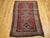 This vintage Caucasian Kazak area rug from the late 1800s features the classic four-gul design — a revered and ancient...