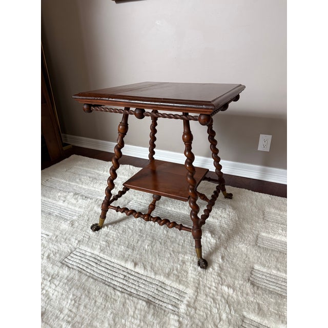 Really stunning and rare solid wood lamp/side table that appears to have been made by the Merklen Furniture Company around...