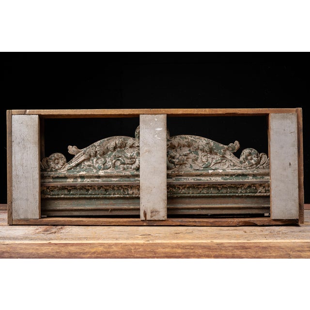 Late 19th to early 20th-century cast iron architectural pediment salvaged from a commercial or institutional building. The...