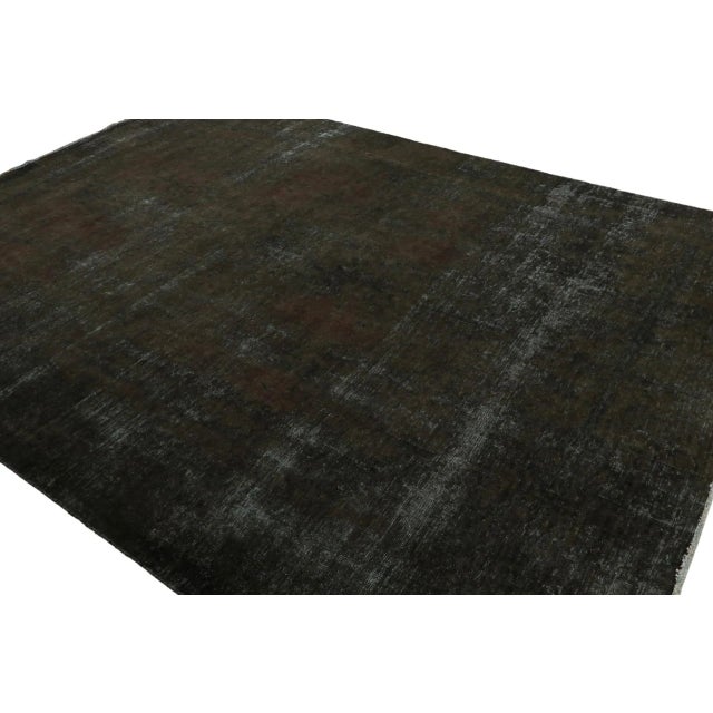 From our new collection of overdyed rugs, a 9×12 vintage Persian rug, hand-knotted in wool circa 1970-1980. On the Design:...