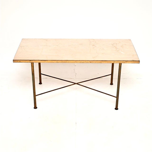 A stylish and very well made vintage French brass and marble coffee table. This was made in France, it dates from around...