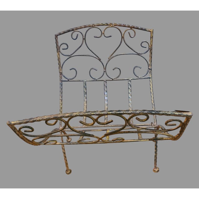 Add a touch of French country elegance to your home with this beautiful wrought iron folding magazine rack. The ornate...