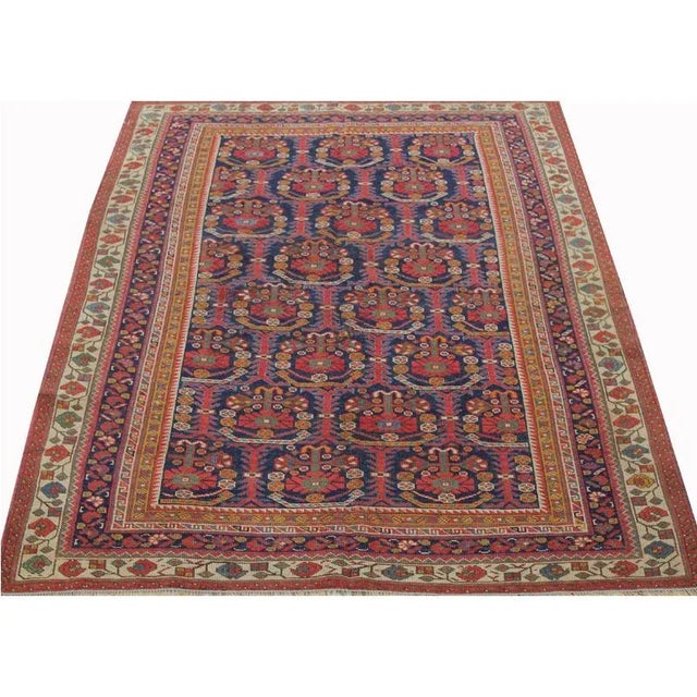 Traditional Antique Handwoven Afshar Area Rug featuring an allover geometric design in a navy-colored field enclosed in an...