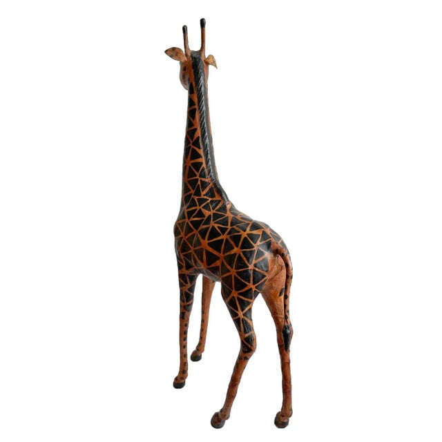 Vintage large giraffe. Hand painted leather on armitage. Deep orange and black tones.