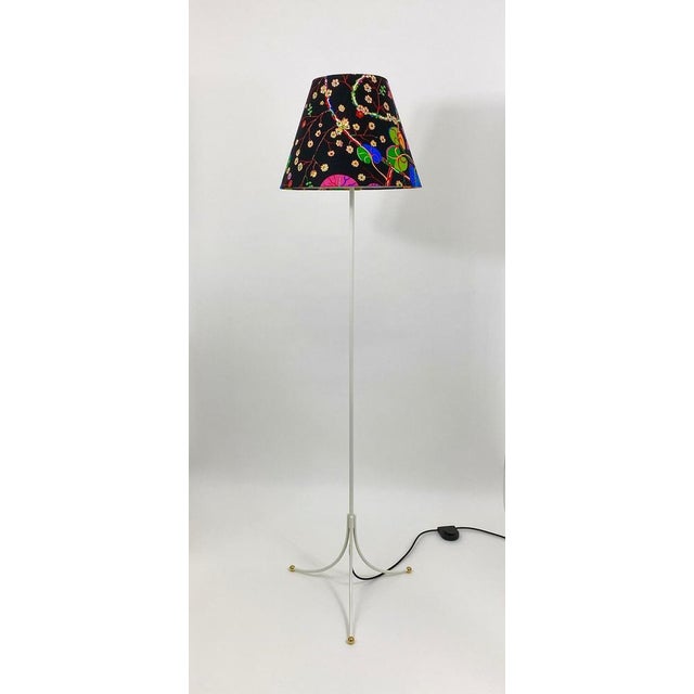 A beautiful Viennese midcentury tripod floor lamp from the 1950s, manufactured by "Haus & Garten", Austria, attributed to...