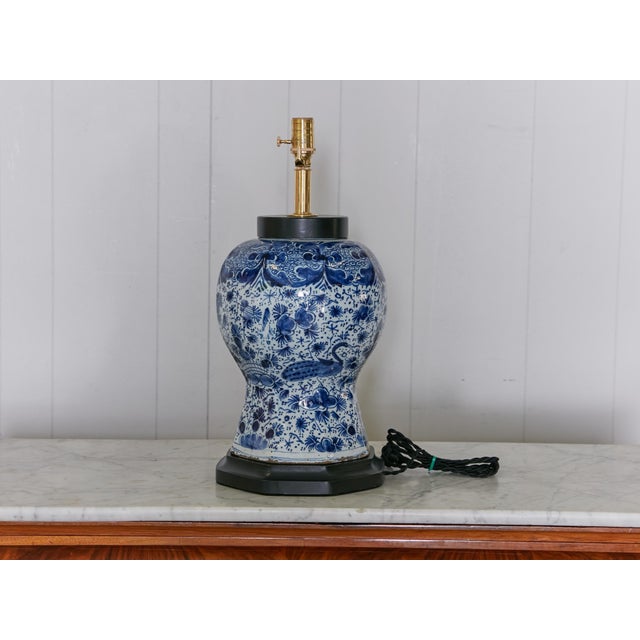 An early 19th century Delft porcelain vase made into a custom table lamp wired for the USA. This early 19th-century Delft...
