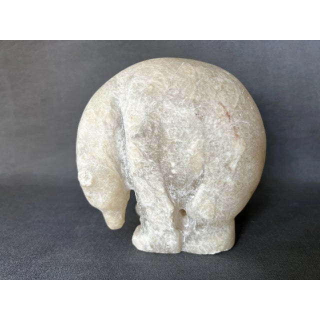 Alabaster carving. inuit art polar bear Approximately 1950. height 13 cm. width 9 cm. depth 13.5 cm. slight damage and...