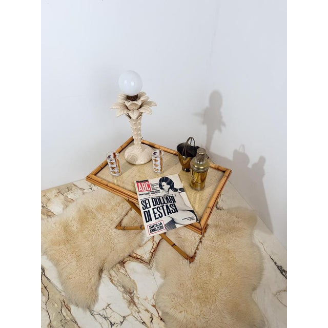 Italian Mid-Century Modern tray table from the 1970s, crafted from bamboo, cane, and woven rattan. Originally sourced from...