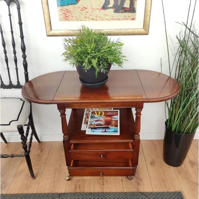 Beautiful French Louis XIII style walnut wood side table features demilune folding sides and great classic details in the...