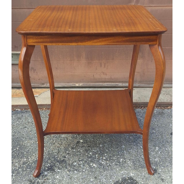 William Barnard Moses & Sons Edwardian Satinwood and pealware Inlaid Mahogany Two-Tier Side Table, Circa 1890s. Measures...