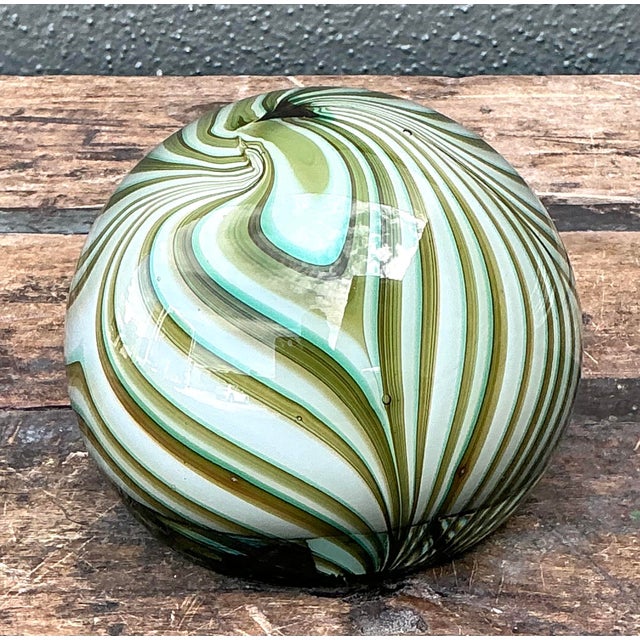 This mesmerizing vintage Murano glass sphere is a testament to the centuries-old glassblowing traditions of Venice. Hand-...