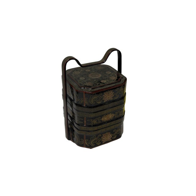 Discover the timeless elegance of this exquisite antique Asian multi-tiered wood lunch box, meticulously handcrafted and...