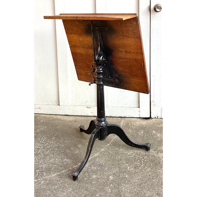 Antique Keuffel & Esser Drafting Table with Iron Base.. this table goes from 30 inches tall to 38 inches tall maybe a...