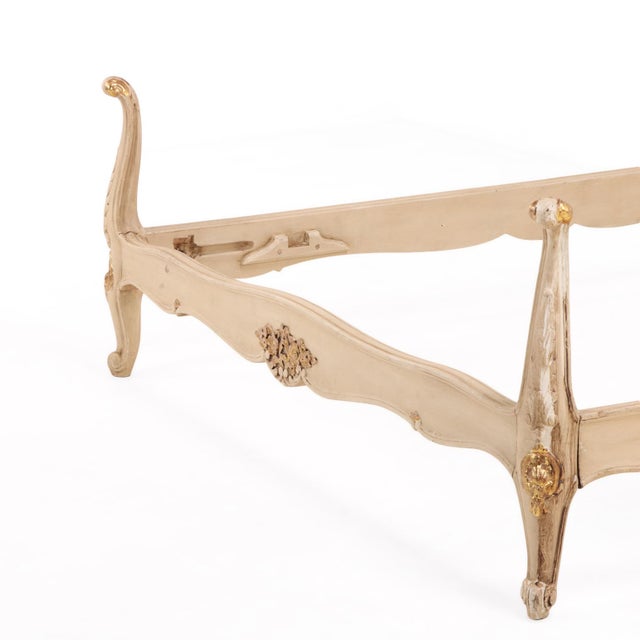 This elegant early 20th-century French Louis XV style bed features a carved wooden frame and a soft painted finish. The...
