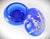 Deep Cobalt Blue Round Covered Glass Box with Hand Painted White Scenic Boy and Girl. The lid is fully and delicately hand...