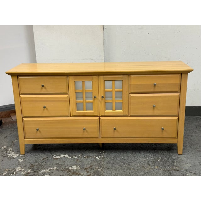 Design Plus Gallery presents a Maple Wood Finished Chest of Drawers from Palliser. The low profile dresser offers two half...