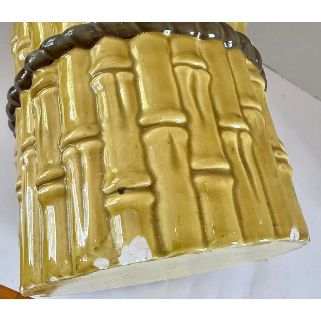 MCM Ceramic umbrella stand with a faux bamboo design. It is a tall, cylindrical vessel with a segmented, ridged texture...