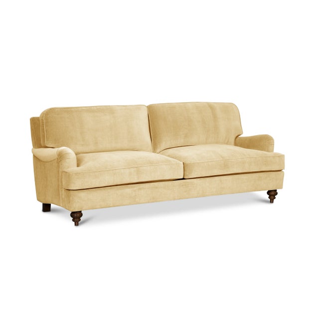 Timeless style meets luxurious comfort in this high-end English Roll Arm sofa. Upholstered in 100% cotton velvet with a...