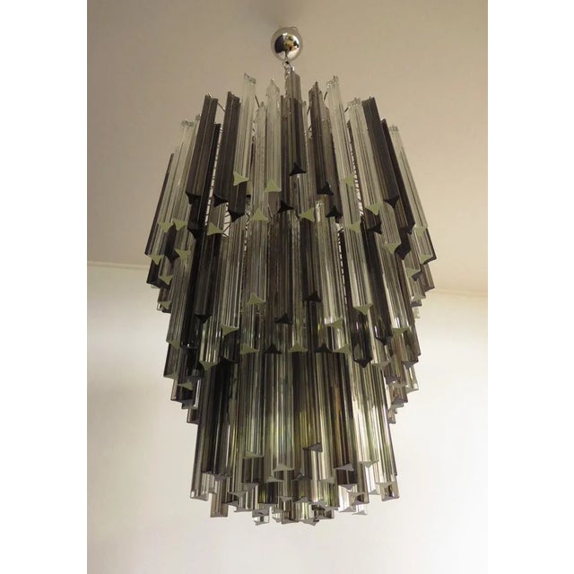 Fantastic vintage murano chandelier made by 184 murano crystal trasaparent and smoked prism in a nickel metal frame. The...