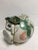 One of a kind , hand thrown adorable piggy bank in soft greens and peach, blue eyed, wearing a bonnet . Pristine condition...